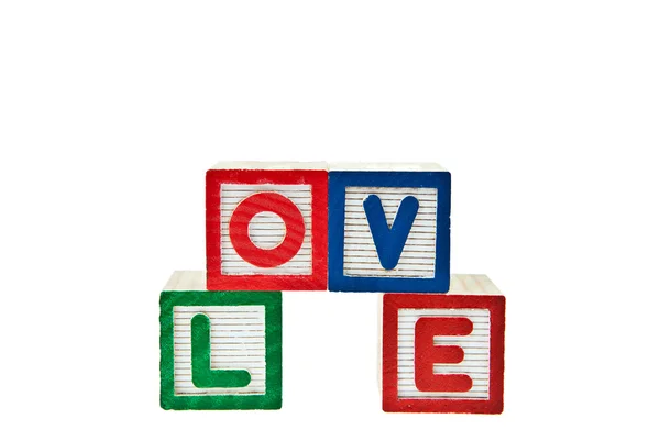 Liefde door blok speelgoed geïsoleerd op witte achtergrond — Stockfoto