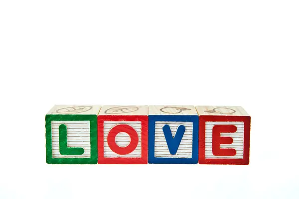 Love by block toy isolated on white background — Stock Photo, Image