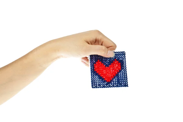 Hand with knitting red heart isolated on white background — Stock Photo, Image