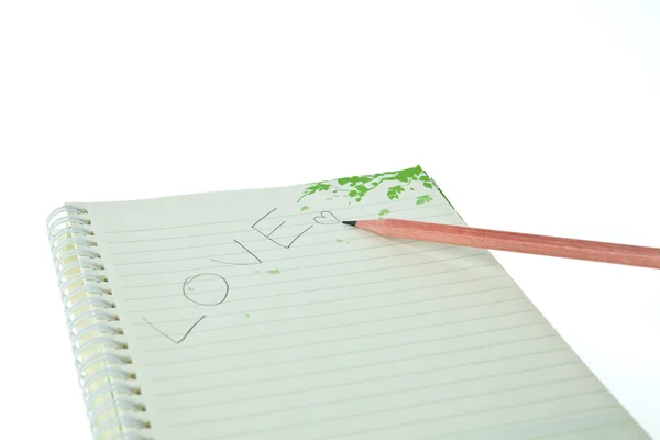 Crayon et cahier avec AMOUR isolé sur fond blanc — Photo