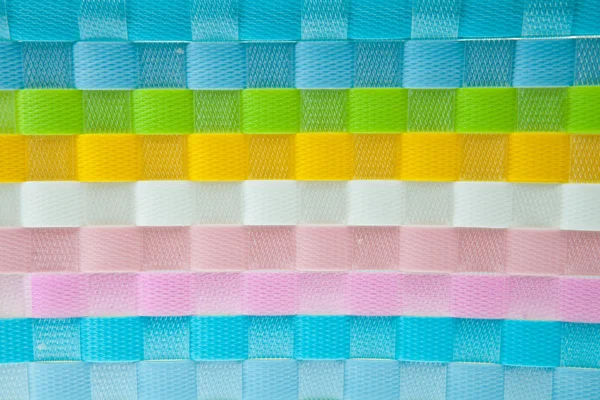 Colorful wicker plastic background — Stock Photo, Image