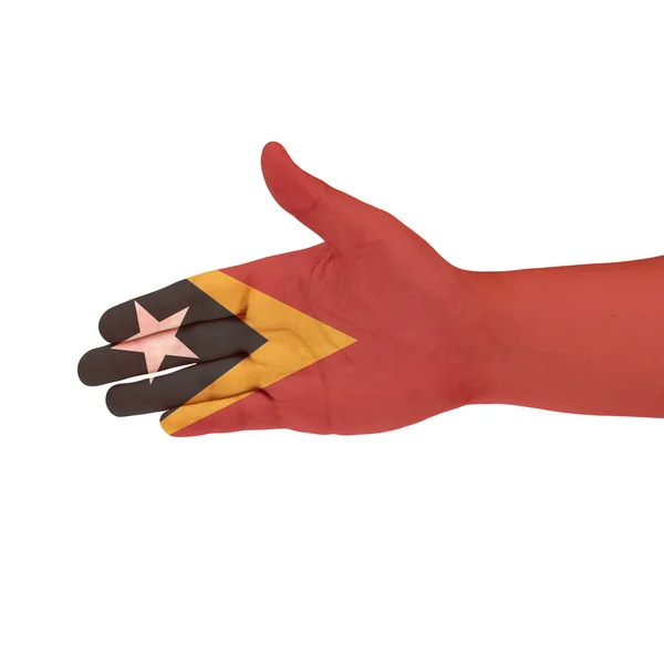 East Timor Flagge auf der Hand isoliert auf weißem Hintergrund — Stockfoto