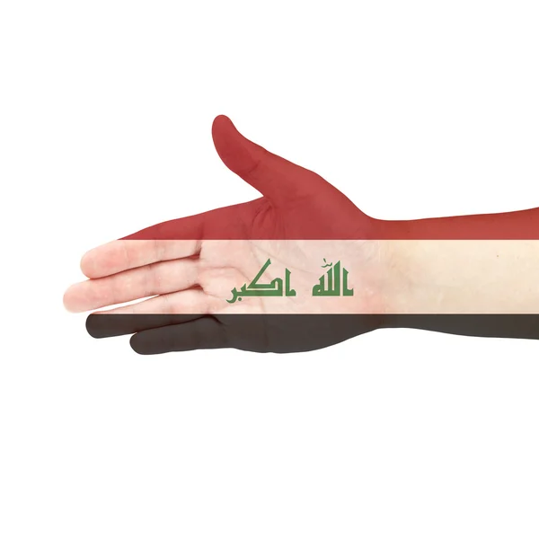 Flaga Iraku na rękę na białym tle — Zdjęcie stockowe