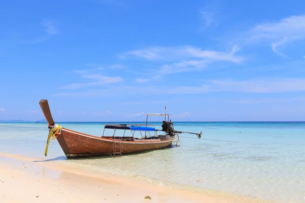 Boat on the beach with blue sky Stock Image