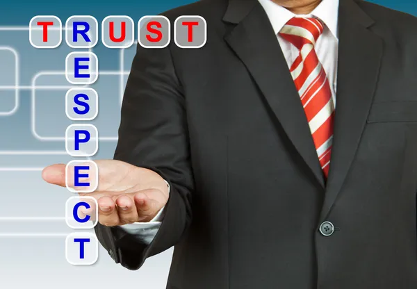 Бизнесмен со словами "Доверие и уважение" — стоковое фото