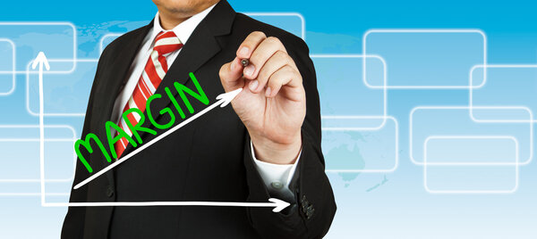 Businessman drawing a graph with Margin going up