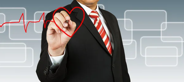 Businessman draw a pulse line with heart — Stock Photo, Image
