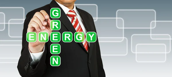 Zakenman hand tekenen van groene energie — Stockfoto