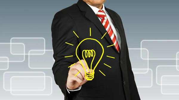 Businessman with bulb — Stock Photo, Image