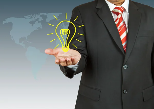 Businessman with bulb — Stock Photo, Image