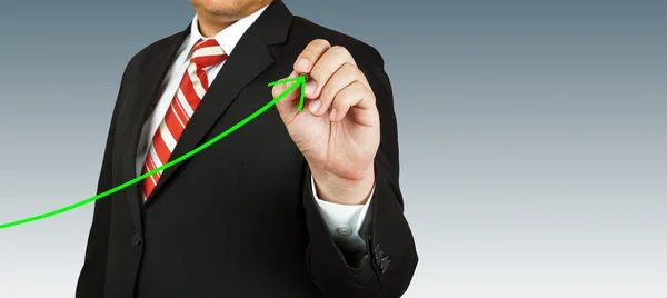 Homem de negócios mão desenho gráfico seta verde — Fotografia de Stock