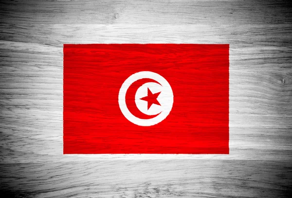 Tunisien flagga på trä textur — Stockfoto