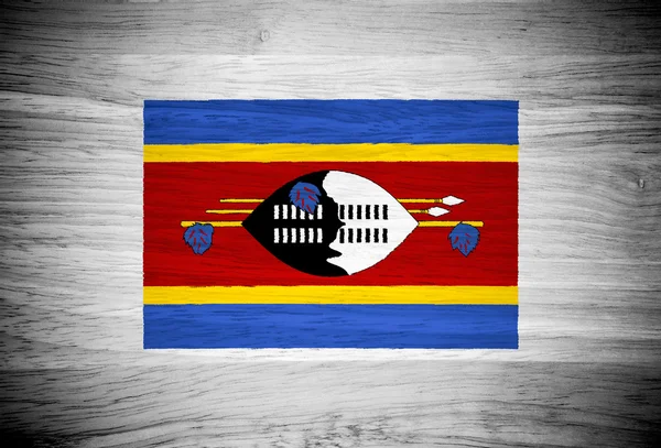 Swaziland flag on wood texture — Stock Photo, Image