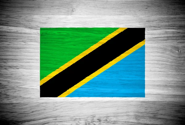 Bandera de Tanzania sobre textura de madera — Foto de Stock