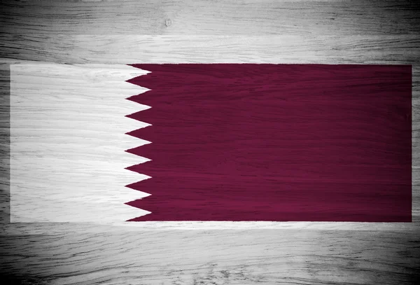 Qatar flag on wood texture — Stock Photo, Image