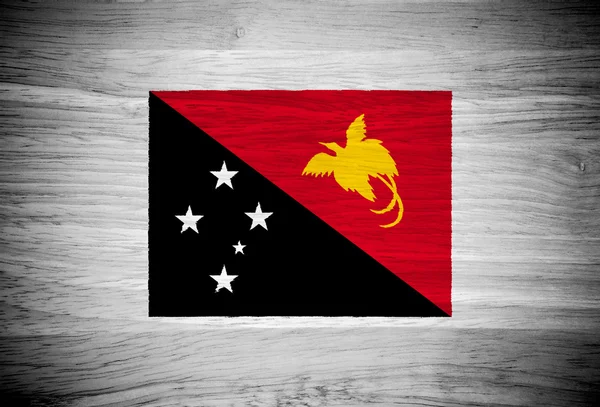 Flaga Papui-Nowej Gwinei na tekstury drewna — Zdjęcie stockowe