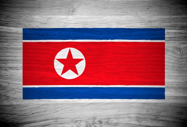 Bandera de Corea del Norte sobre textura de madera — Foto de Stock