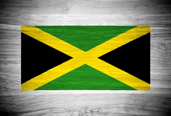 Jamaica flagga på trä textur — Stockfoto