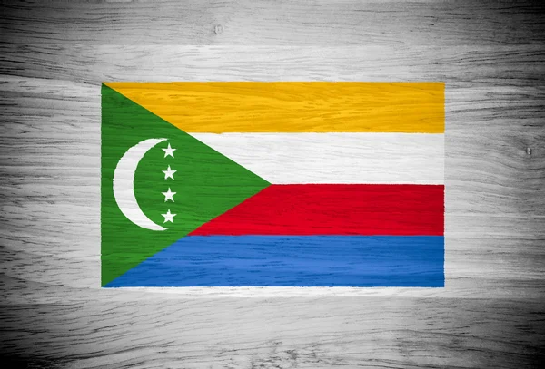 Komorská vlajka na texturu dřeva — Stock fotografie