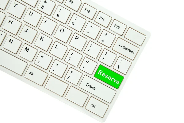 Wording Reserve en el teclado de la computadora aislado en el fondo blanco — Foto de Stock