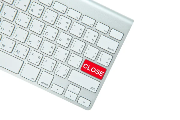 Red close button on computer keyboard isolated on white backgrou — Stock Photo, Image