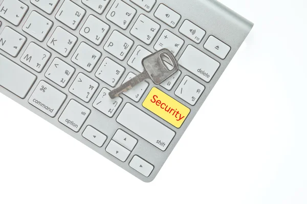 Tecla chave e botão de segurança no teclado do computador isolado em branco b — Fotografia de Stock