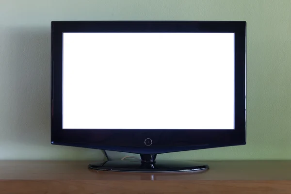 Televisor de pantalla plana negro en mesa de madera —  Fotos de Stock