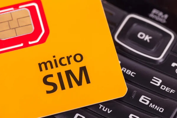 Mobile phone with micro sim card — Stock Photo, Image