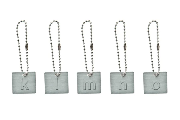 Küçük harf k-o ile gümüş metal anahtar etiketi — Stok fotoğraf