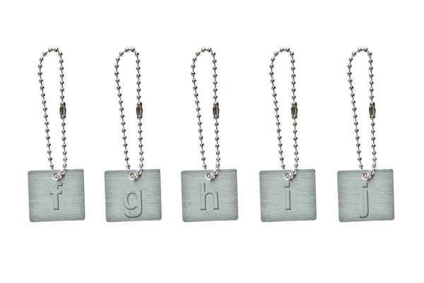 Küçük harf f-j ile gümüş metal anahtar etiketi — Stok fotoğraf