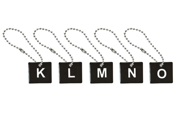 Černá kovová klíčenka s písmeno k-o — Stock fotografie