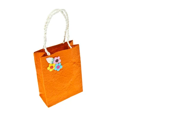 Beyaz arka plan üzerinde izole turuncu dut kağıt çanta — Stok fotoğraf