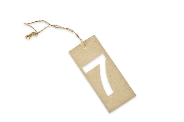 Brown paper tag with number seven cut — Stock Photo, Image