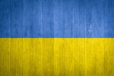 Ukraine Flag on wood background clipart