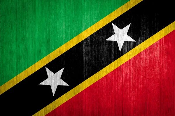 São Cristóvão e Nevis Bandeira sobre fundo de madeira — Fotografia de Stock