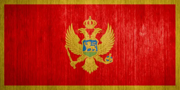 Montenegro Bandeira sobre fundo de madeira — Fotografia de Stock