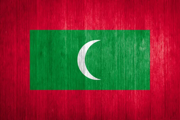 Bandera de Maldivas sobre fondo de madera — Foto de Stock