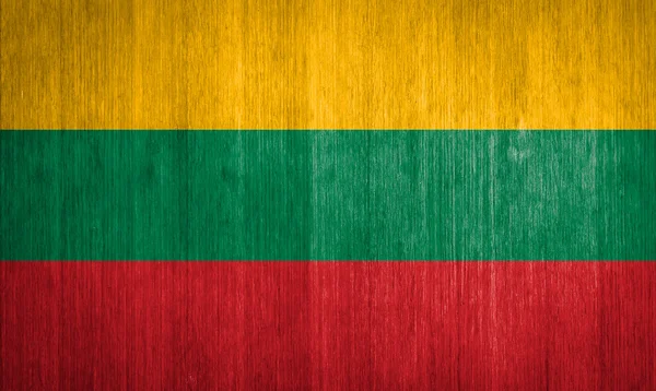 Lithuania Flag on wood background — Stock Photo, Image