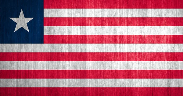 Libéria Bandeira sobre fundo de madeira — Fotografia de Stock