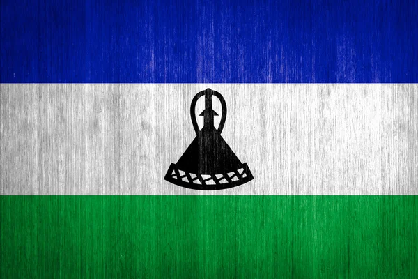 Lesotho Flag on wood background — Stock Photo, Image