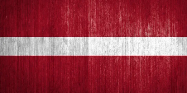 Latvia Flag on wood background — Stock Photo, Image