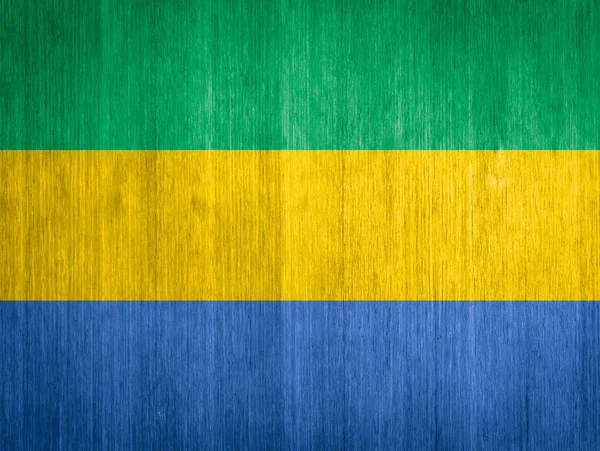 Gabon Flagge auf Holz Hintergrund — Stockfoto