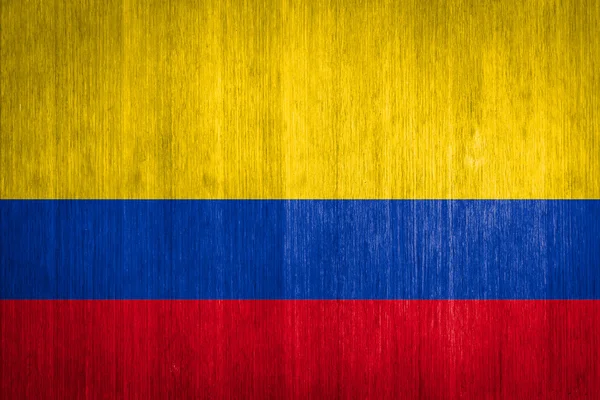 Colombia Bandera sobre fondo de madera — Foto de Stock