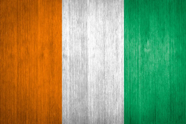 Ivory Coast Flag on wood background — Stock Photo, Image