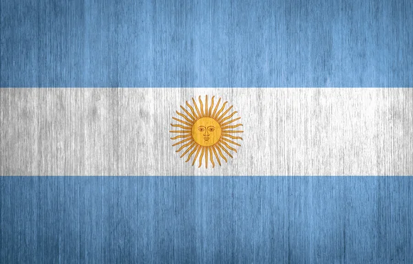 Bandera Argentina sobre fondo de madera — Foto de Stock