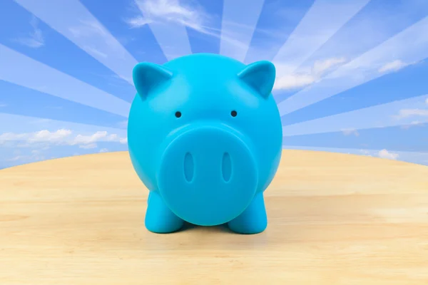 Piggy bank on desk — Stock Photo, Image