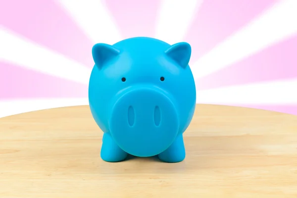 Piggy bank on desk — Stock Photo, Image