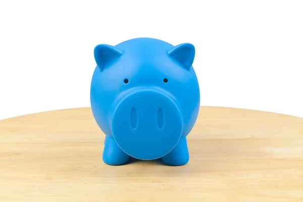 Piggy bank on desk — Stock Photo, Image