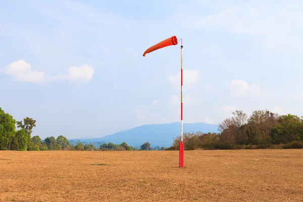 Airport flagpole on ground field — Stock Photo, Image