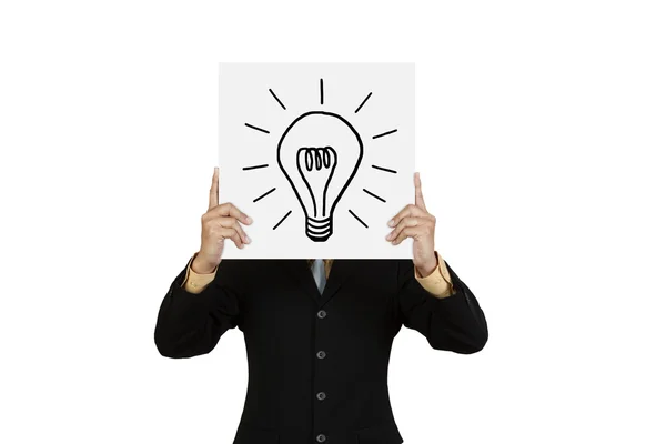 Businessman with lightbulb on board — Stock Photo, Image